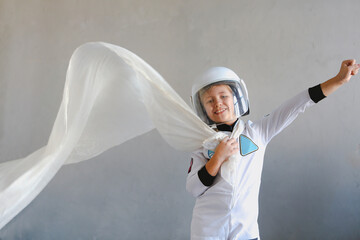 Astronaut futuristic kid girl with white full length uniform and helmet