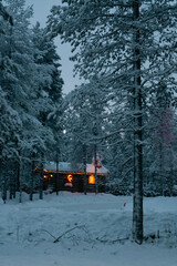 Cozy house in the snowy forest. Santa Claus residence
