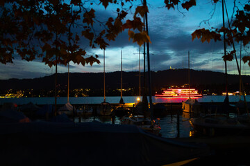 Colourful boat on Lake Zurich, at night