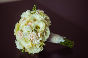 Bright Beautiful bridal bouquet with roses and ribbon. 