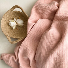 Soft fluffy pink muslin blanket. Organic double gauze cotton fabric.  - obrazy, fototapety, plakaty