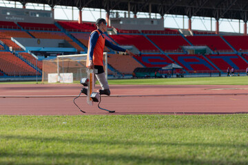 Disabled athletes prepare in starting position ready to run on stadium track