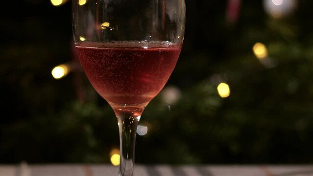 Glass of red wine on Christmas background