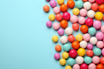 Obraz premium Round multi-colored candies on a blue background