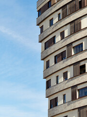 Tall housing blocks with a large number of windows and terraces. Singular buildings.