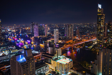 Beautiful cityscape Bangkok river boat business district and residential. In the twilight,
