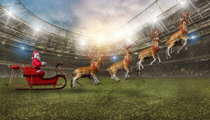 Santa claus in a soccer stadium with his sleigh ready to deliver presents