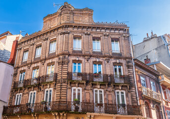 Facades of buildings in Rue Saint Rome in Toulouse in Occitanie, France