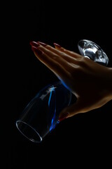 Female hand with champagne glass on black and white background