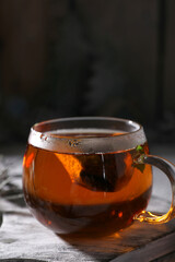Hot black tea in a transparent glass
