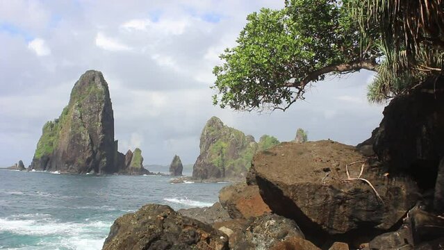 Beautiful view of a beach with majestic hills in Blitar, East Java, Indonesia.
