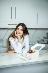 Portrait of confectioner woman with cake made by her hands