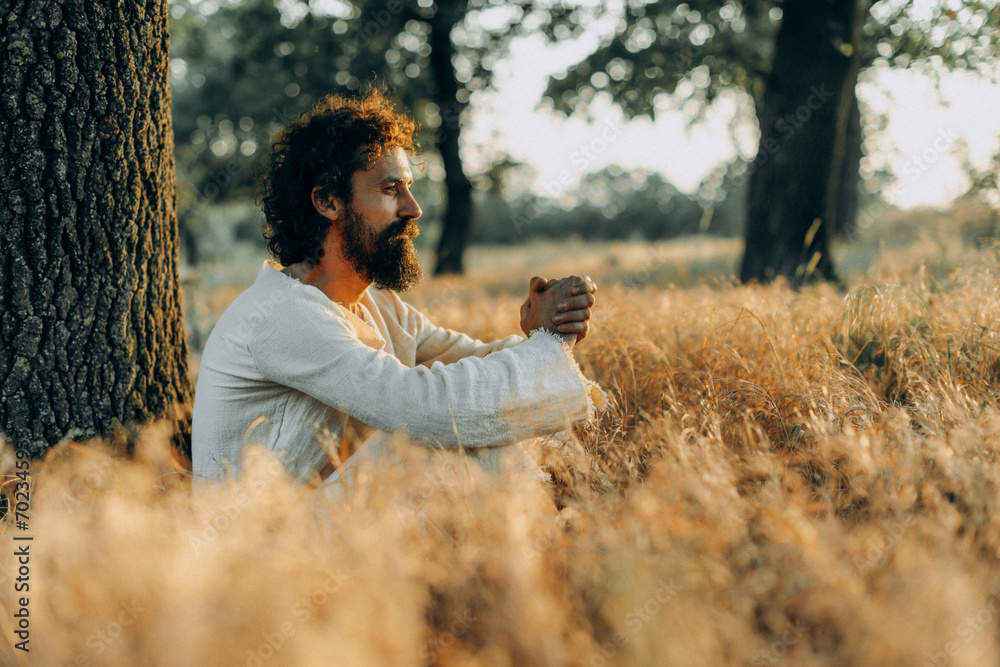 Wall mural jesus christ alone in the garden, meditating and praying