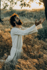 Jesus Christ Alone in the Garden, Meditating and Praying - 702345983