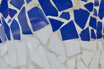 Colourful mosaic of broken tiles in blue and white colours. Photo for backdrop and background