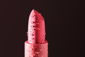 Red lipstick with water drops on a dark background.