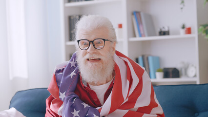 An extremely surprised old man is shocked by the victory of the US soccer team, proud to be a...