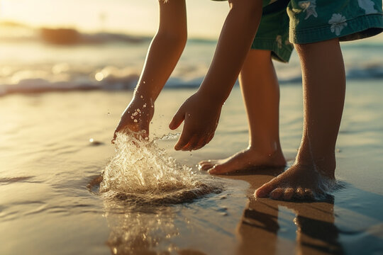 Child rinsing sand off feet at beach in summer