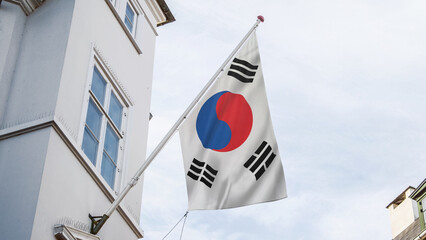 korea flag in front of top of the building
