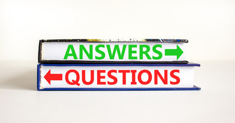 Questions and answers symbol. Concept word Questions Answers on beautiful books. Beautiful white table white background. Business questions and answers concept. Copy space.