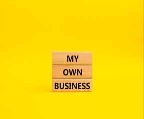 My own Business symbol. Concept words My own Business on wooden blocks. Beautiful yellow background Business and My own Business concept. Copy space.