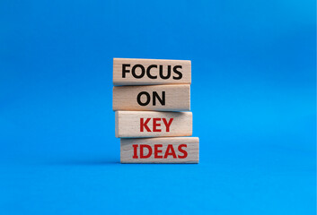 Focus on Key Ideas symbol. Concept words Focus on Key Ideas on wooden blocks. Beautiful blue...