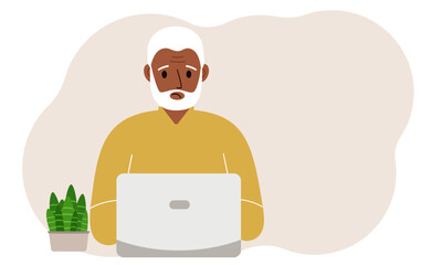 A man is working or studying at a laptop. Freelancing or distance learning and work concept.