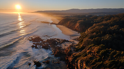 Obraz premium A sun rising on the horizon on a beach, facing the sea, where all you can see is sand, sea and sun,