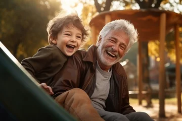 Foto op Canvas Happy grandfather and child have fun and play in park  © Ahmed