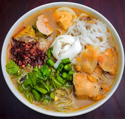 Myanmar traditional or classic rice noodle fish soup called mohinga
