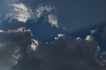 Background of rainy fluffy clouds floating on a bright blue sky, Sofia, Bulgaria   