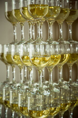 Pyramid of glass glasses with sparkling wine, champagne