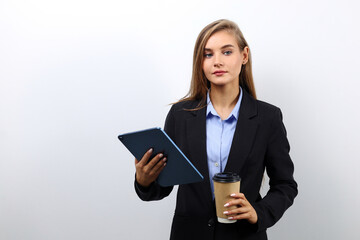 Cute female secretary using tablet for work purposes