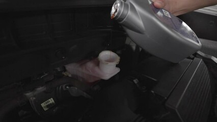 Close up footage of a Maintenance Car service - auto oil change, motor check, brake cleaning, tire check, engine inspection, motor oil-brake inspection