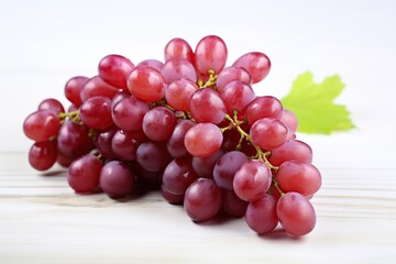 Fototapeta premium Ripe red grape on wooden background