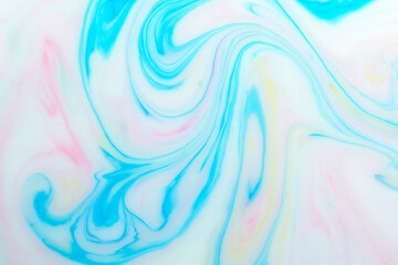 Background with multicolored veins milky white background. Texture of marble.