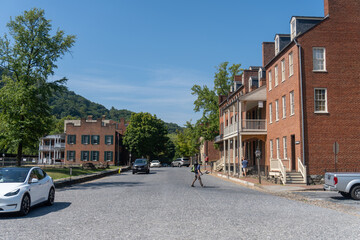 Harpers Ferry, West Virginia: Appalachian Trail hiker crosses Shenandoah Street near John Brown's Fort. AT crosses through Harpers Ferry National Historic Park. 