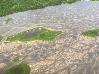 Crescent River or Red River in Lake Clark National Park and Preserve in Alaska. River originates from glaciers and drain into Cook Inlet. Braided river rich with sediment.