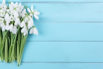 Blooming snowdrop flowers on wooden background