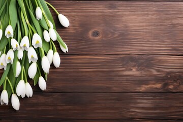 Blooming snowdrop flowers on wooden background