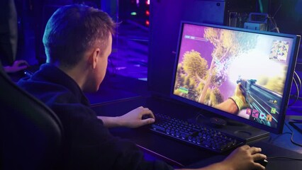 Player enjoying the modern digital fake game with cartoon graphics. Player shooting at the enemies in the online fake game. Player winning the match of the fake battle royale computer game.