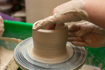 Clay, pottery or hands in designer workshop working on an artistic cup or mug mold in small business studio. Hand of creative artist or worker manufacturing handicraft products in sculpture