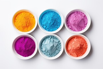 Obraz na płótnie Canvas Colorful holi powder in bowls on white background