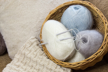 Materials for creativity. Knitting needles and threads. Hobby and creative leisure concept. Place for handicrafts. Selecting materials for a knitting project. - 702442909