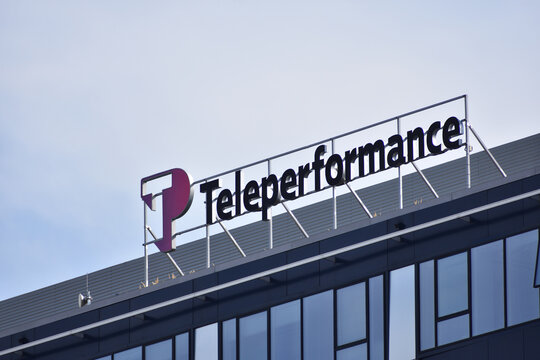 Teleperformance company logo, emblem on the facade of IT outsourcing company. WARSAW, POLAND - SEPTEMBER 23, 2023