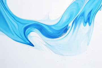 Splashes and drops of blue acrylic paint sliding on a white canvas