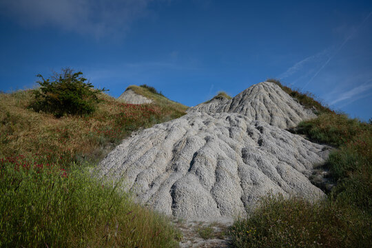 Bare hills of white clay in the Crete Senesi, Tuscany, Italy. A moonscape also called the Accona Desert, between the municipalities of Asciano, Buonconvento and Montalcino.