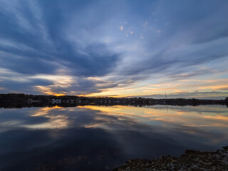 Beautiful lake with reflections in the water at sunset with spectacular colors. landscape photography