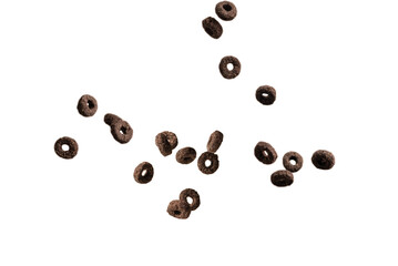 Chocolate rings cereal spill out into a bowl. Breakfast.