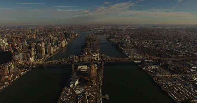 Drone shot up the Hudson River towards Queensbridge, New York City Manhattan skyscrapers